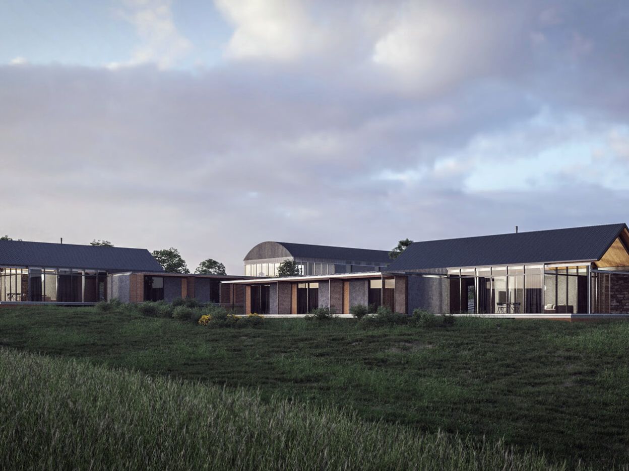 Luxury holiday homes on a historic farmstead at Old Head Golf Links, County Cork, with serviced cottages enclosing a communal courtyard.